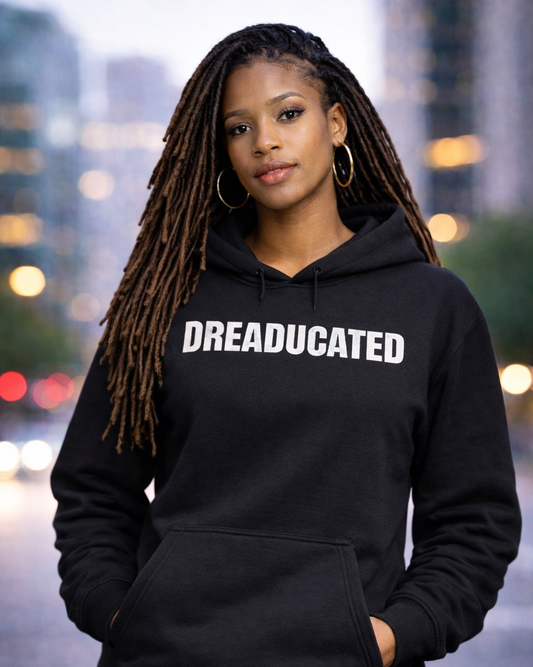 Person wearing a black hoodie with 'DREADUCATED' text, standing in an urban setting.